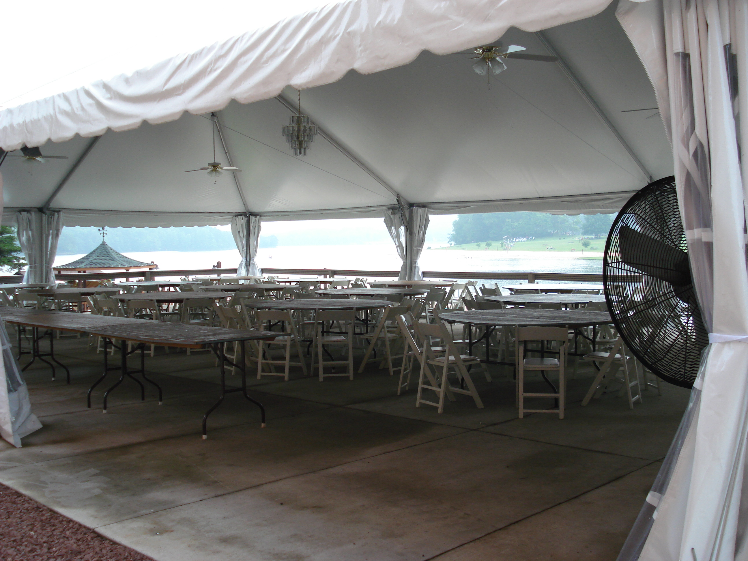 outdoor tented area setting up for an event