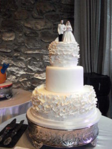 white fondant round wedding cake ruffles lulu cake boutique
