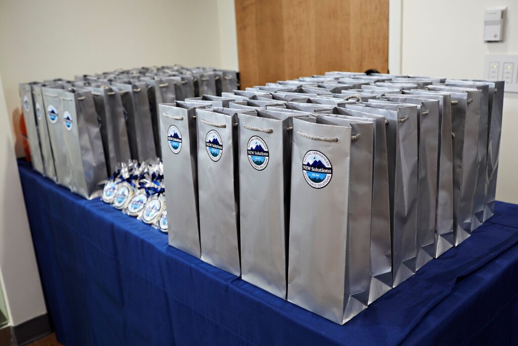 corporate anniversary party favors wine and cookies