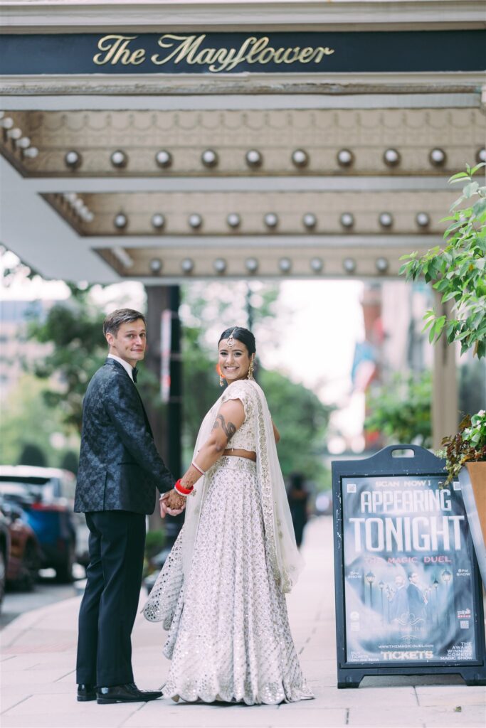 indian_fusion_wedding_mayflower_hotel_dc couple portraits hotel front door